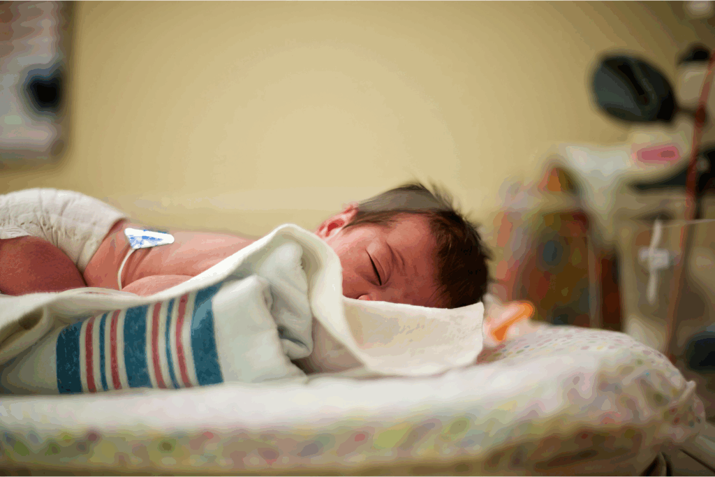 Neonate in nICU laying on their stomach.